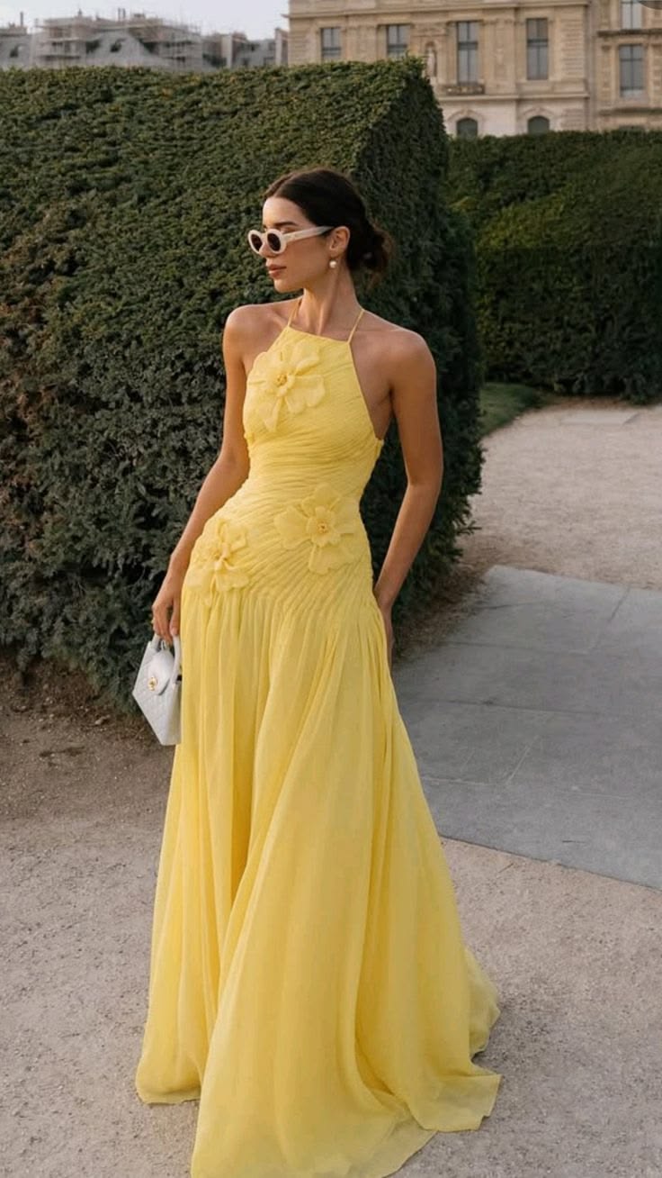 Yellow halter gown with floral appliqué