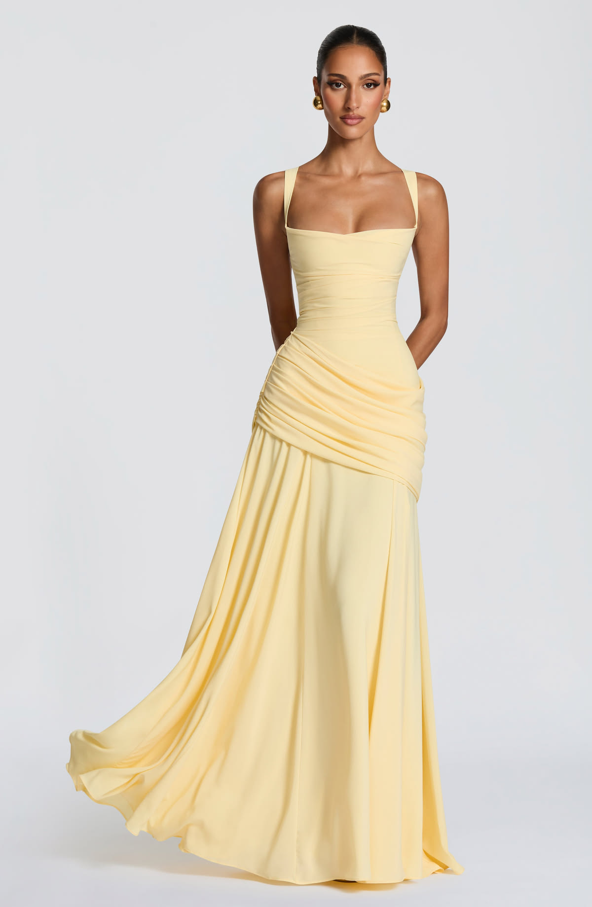 Soft yellow floor-length draped gown