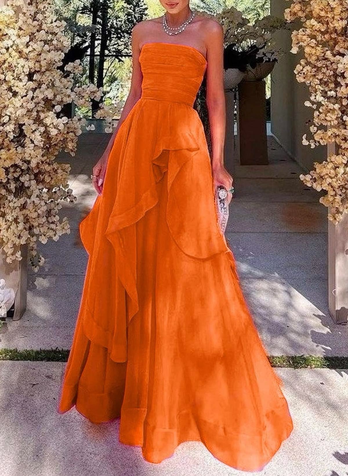 Bright orange strapless tiered gown